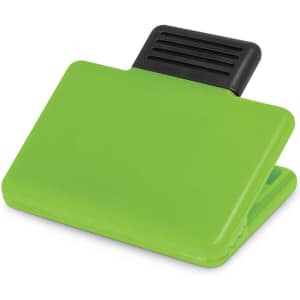 A green magnetic clip with a black grip section, designed for securing papers or notes.