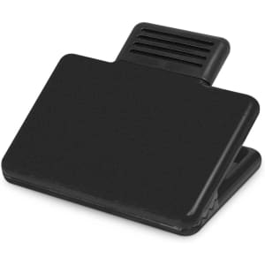 A black magnetic clip with a flat surface and a textured grip on top, designed for office use.