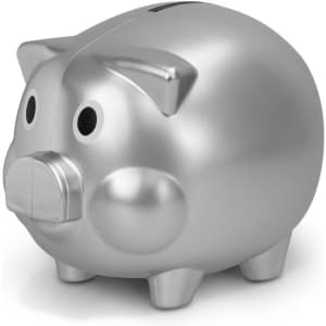 A silver piggy bank with a friendly face, featuring a slot on top for coins and four short legs.