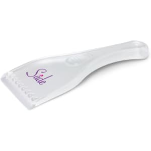 A transparent ice scraper with a textured edge and a curved handle, featuring a logo on the surface.