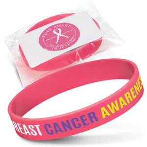A pink silicone wristband featuring text, packaged for promotional use, with a logo visible on the wrapper.