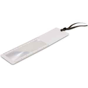 A bookmark magnifier in white with a transparent lens and a brown ribbon attachment. It features a ruler along one edge.