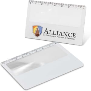 A card magnifier in white with a ruler along the top edge and a logo on one side.
