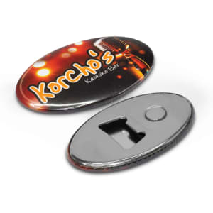 A drink bottle opener in oval shape with a metallic finish, featuring a logo and a black backing.