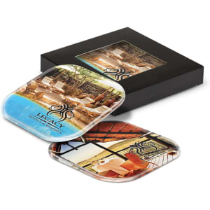 A coaster set featuring two decorative coasters in vibrant colours, presented in a stylish black box with a logo.