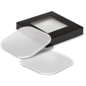 A set of clear coasters with rounded edges, displayed in a black box with a transparent window.