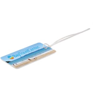 A rectangular luggage tag in blue featuring a beach scene, with a clear strap for attachment.