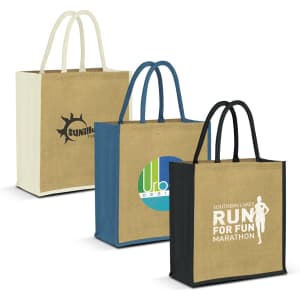Three jute tote bags in beige, blue, and black with handles, each featuring different logos and designs.