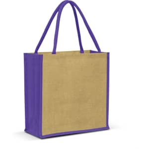 A jute tote bag in natural beige with purple handles and trim, featuring a small logo on one side.