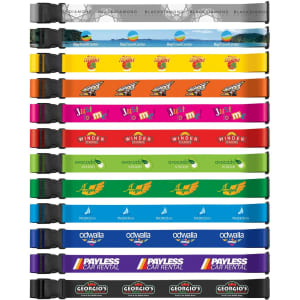 A collection of colourful luggage straps in various shades, featuring multiple logos and designs.