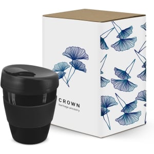A drink bottle in black, accompanied by a decorative box featuring floral designs.