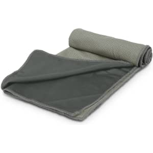A rolled premium cooling towel in dark green with a mesh texture and contrasting edge. Features branding.