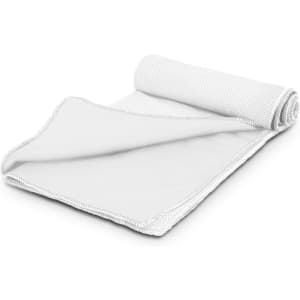 A white cooling towel with a textured surface, rolled loosely, highlighting its lightweight and breathable material.