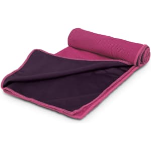 A pink and purple cooling towel rolled out, featuring a textured side and a smooth side, with a logo present.