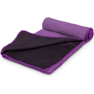 A rolled up cooling towel in purple and black, featuring a mesh design and a brand logo.