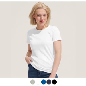 A woman is wearing a white t-shirt, with a logo, paired with blue jeans, set against a light background.