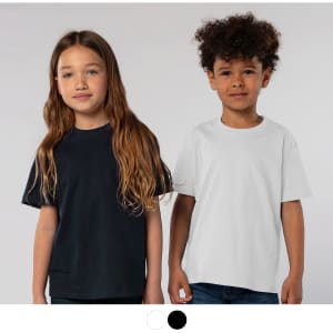 Two children standing side by side, one wearing a black t-shirt and the other wearing a white t-shirt. Both are smiling.
