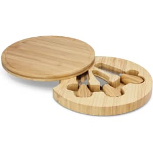 A round bamboo cheese board with a removable section containing cheese knives.