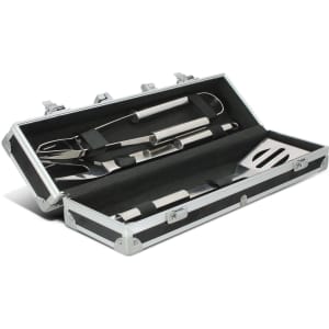 A BBQ set featuring stainless steel tools, including a spatula, tongs, and fork, housed in a black case with silver accents.