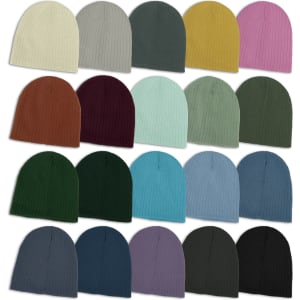 A collection of beanies in various colours, including cream, grey, green, yellow, pink, and more. Each has a ribbed texture.