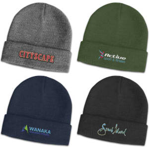 A collection of beanies in grey, green, navy, and black featuring various logos and designs on the front.