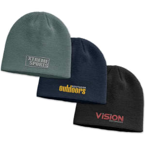 A collection of three knit beanies in dark green, navy, and black, featuring various logos.