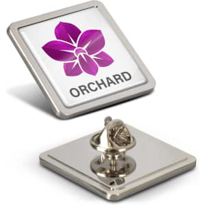 A square lapel pin featuring a purple flower design with a metallic back.