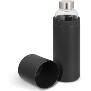 A drink bottle made of clear glass with a stainless steel lid, presented inside a sleek black packaging tube.