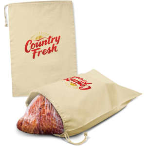 A beige ham storage bag with a drawstring closure and a logo, displaying a ham inside.