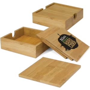Bamboo coasters in natural tones, featuring a box and lids, with a logo on one of the coasters.