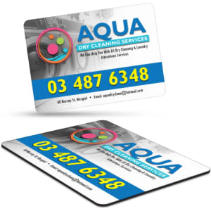 A rectangular fridge magnet featuring a colourful design with a logo, contact information, and services, primarily in blue and white.