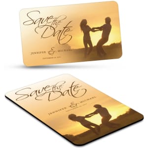 A rectangular fridge magnet featuring a sunset scene with two dancers, in warm colours, with a logo.