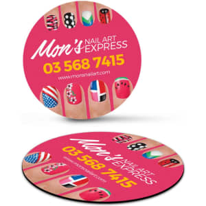 A circular fridge magnet featuring colourful nail art designs and a logo, predominantly in pink and featuring multiple colours.