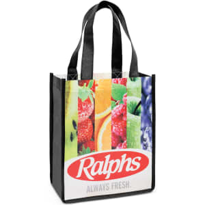 A tote bag featuring a vibrant fruit design with black straps and a logo on the front.