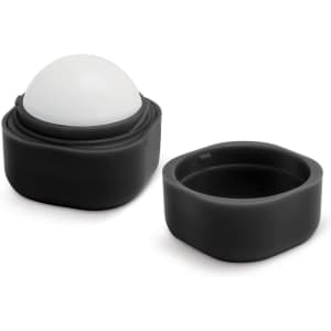A black lip balm container featuring a rounded, white top. Includes an outer casing and a removable lid.