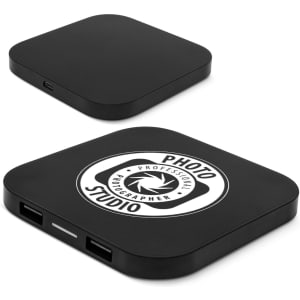 A black wireless charging hub with a logo on top and two USB ports on the side.