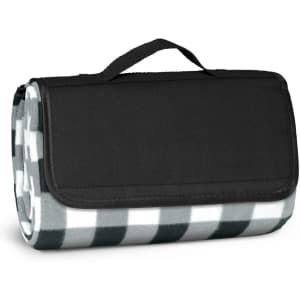 A folded picnic blanket featuring a green and white checkered pattern, with a black carrying handle.