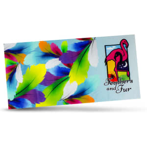 A colorful beach towel featuring vibrant feathers and a flamingo design, labeled "Feathers and Fur."
