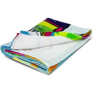 A folded beach towel featuring vibrant colours and an abstract design, with a branded logo.