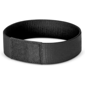 A black fabric wristband featuring a secure fastening, suitable for events and exhibitions.