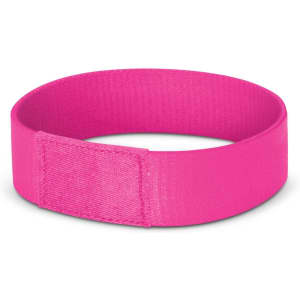 A vibrant pink wristband designed for events and exhibitions, featuring a smooth finish and a secure closure.
