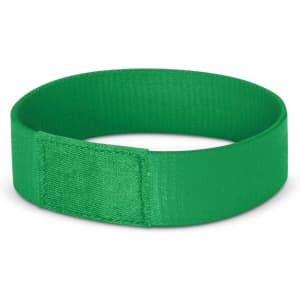 A green wristband with a smooth finish, featuring a simple design and a logo on the side.