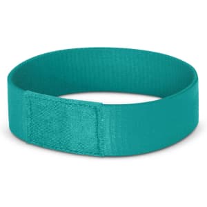 A teal Dazzler Wrist Band designed for events, featuring a simple, smooth texture and a secure fastening.