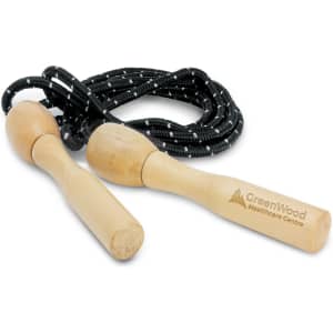 A skipping rope with wooden handles and a black rope featuring a white speckled pattern. It has a logo on the handles.