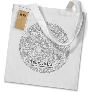 A white tote bag featuring a circular design of various items and a pocket holding colourful pencils.