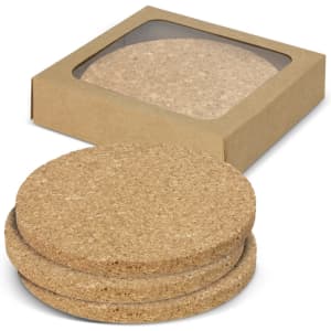 A set of four round cork coasters in a cardboard box, featuring a natural, light brown colour.