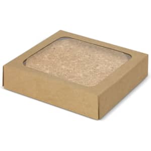 A square, brown cardboard box containing a set of four round cork coasters. The coasters have a natural cork colour.
