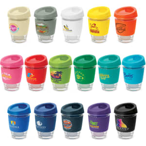 A collection of colourful drink bottles with clear glass bases and coloured lids, featuring various logos.
