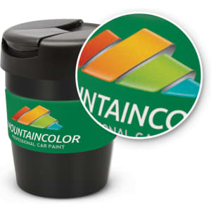 A drink bottle in black with a green sleeve, featuring a logo. The lid has a secure snap closure.