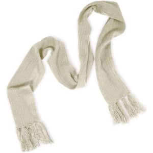 A Nebraska Cable Knit Scarf in a soft, light beige color with fringed ends.